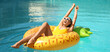 © Pixel-Shot - Pretty young woman with inflatable ring in swimming pool. Banner for design