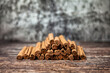 Close-up of ceylon cinnamon sticks on wooden table, rustic style still life. Natural food of sri-lankan cinnamon for poster or banner. Delicious tasty healthy concept. Copy advertising text space