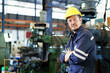 © DG PhotoStock - Smart and good looking senior factory or mechanical engineer standing in the factory portrait, caucasian white male engineer or foreman portrait in factory.