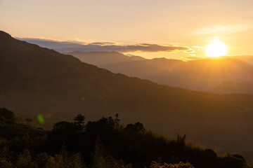 Poster - Sunset sunlight flare over the mountain