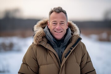 Wall Mural - Headshot portrait photography of a happy mature boy wearing a cozy winter coat against a wildlife reserve background. With generative AI technology