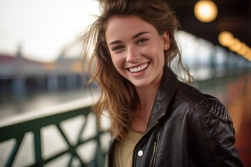 Poster - Close-up portrait photography of a joyful girl in her 30s wearing a sleek bomber jacket against a scenic riverboat background. With generative AI technology