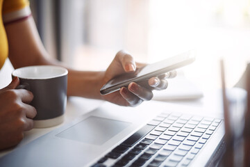 Aufkleber - Hands, smartphone and texting closeup with laptop, coffee and work in home office or shopping, browsing and mobile communication. Woman, social media and keyboard or scrolling, online and search