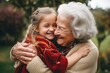 © InputUX - Heartwarming and authentic moment of a young girl endearingly hugging her grandmother, symbolizing love and the bond of family, generative ai