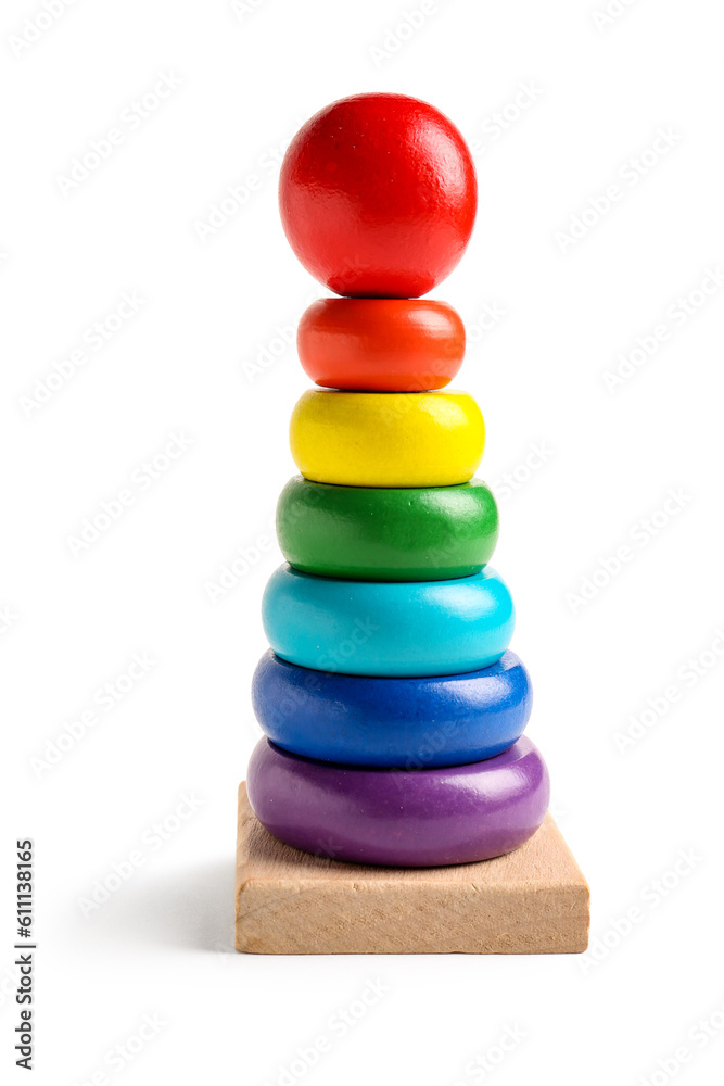 Wooden colorful toy pyramid isolated on white background. Children's Day celebration