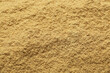 Aromatic mustard powder as background, top view