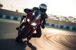 Motorcycle rider on sport bike rides fast on race track at sunset. Extreme athlete Sport Motorcycles Racing, AI Generated