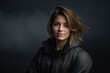 © Markus Schröder - Environmental portrait photography of a grinning girl in her 30s wearing a sleek bomber jacket against a dramatic thunderstorm background. With generative AI technology