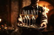 © alexkoral - tray with glasses of champagne in the hands of a waiter in a luxury restaurant for a wedding celebration. Generative AI illustration
