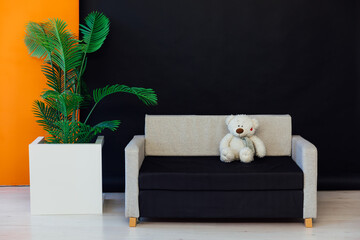 Canvas Print - Sofa with bear decorative flower interior in the room