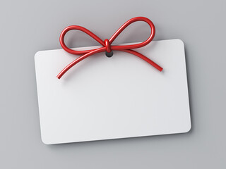 Blank gift card or white note with red rope bow isolated on white grey background with shadow minimal conceptual 3D rendering