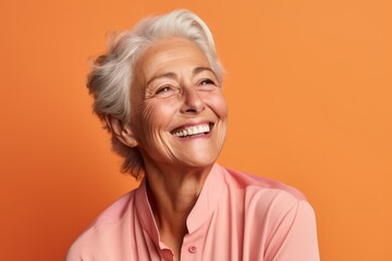 Wall Mural - Close-up portrait photography of a grinning mature woman covering one eye against a pastel orange background. With generative AI technology