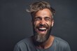 Medium shot portrait photography of a satisfied boy in his 30s laughing against a cool gray background. With generative AI technology