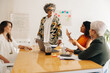 © Jacob Lund - Group of businesswomen having a meeting in a boardroom
