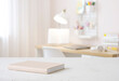 © didecs - Book on table with blurred teenager room background