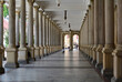 Long corridor between many columns in Mill Colonnade. Day shoot. It is a large colonnade containing several hot springs.