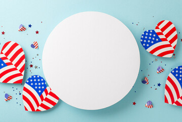 Wall Mural - Memorial Day festivity. From above, observe symbolic embellishments: American flag patterned hearts, and confetti, placed on a pastel blue surface with an empty circle for text or promotion