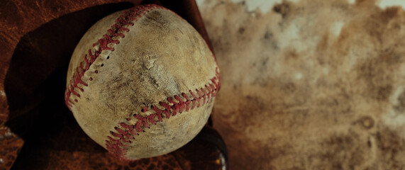 Wall Mural - Old grunge style background with used worn baseball equipment on banner with copy space