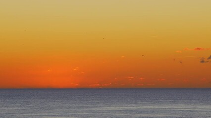 Wall Mural - Beautiful evening sunset in the Atlantic Ocean at Portugal coast. 