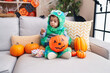 © Krakenimages.com - Adorable hispanic boy having halloween party holding sweets at home