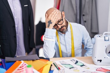 Sticker - Young bald man tailor stressed sitting on table at tailor shop