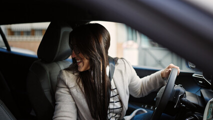 Sticker - Young beautiful hispanic woman smiling confident driving car at street