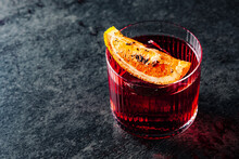 Cocktail Negroni With Gin, Campari Martini Rosso And Orange. Negroni Cocktail In Table
