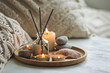 © ArtSys - Cozy corner for home meditation and relaxation. Aroma diffuser, burning candles, stones for comfort, pleasure, aromatherapy. Decor for apartment, house, indoors design