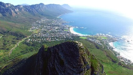 Wall Mural - Drone, mountains and nature with a view of the landscape in Cape Town, South Africa during summer. Aerial, earth and natural countryside with rocky mountain terrain or scenery outdoor during the day