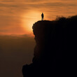 © Danielle - silhouette of a person on a rock