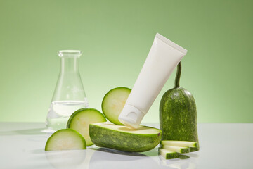 Wall Mural - A white cosmetic tube with fresh winter melon slices and erlenmeyer flask displayed on a light green background. Winter melon helps to tighten skin, smooth skin, whiten pink and prevent acne.