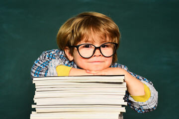 Fototapete - Schoolboy. Blackboard background. Elementary school. School dream. Daydreamer school child. Dreams and imagination. Dreamy school kid face.