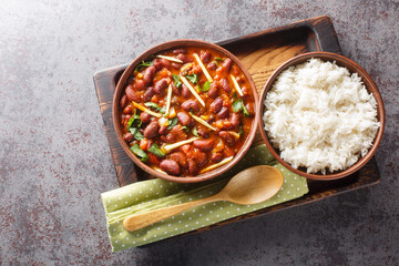 Wall Mural - Rajma Chawal is a popular North Indian Food made of Red kidney beans cooked with onions, tomatoes and a special blend of spices, served with Rice close-up. Horizontal top view from above