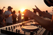 Dj mixing outdoor at beach party festival with crowd of people at sunset. Generative ai