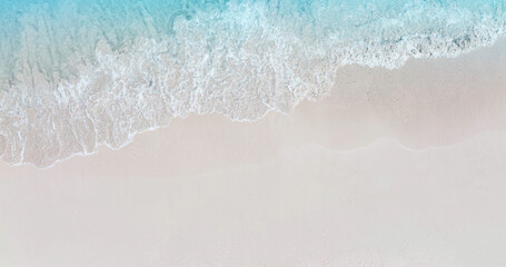 Wall Mural - Aerial view with beach in wave of turquoise sea water shot, Top view of beautiful white sand background