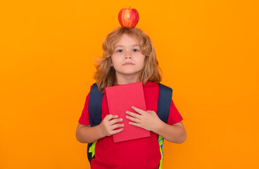Aufkleber - Apple on head, idea concept. Child from elementary school with book and apple isolated on yellow background. Little student, clever nerd pupil ready to study.