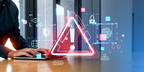 Poster - hands typing on laptop with cybersecurity alert screen