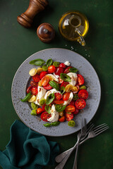 Wall Mural - healthy colorful tomato mozzarella basil salad with balsamic vinegar dressing