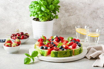 Wall Mural - watermelon pizza slices with yogurt and berries, summer dessert