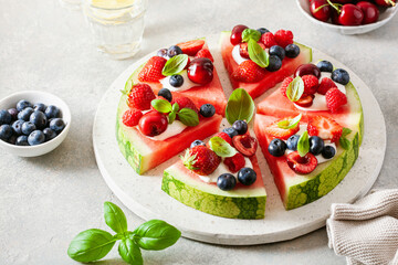 Wall Mural - watermelon pizza slices with yogurt and berries, summer dessert