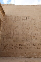 Wall Mural - Inscriptions on the walls of the mortuary temple of Medinet Habu in Luxor in Egypt