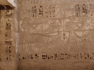 Wall Mural - Inscriptions on the walls of the mortuary temple of Medinet Habu in Luxor in Egypt