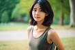 © wazamai - Beautiful Japanese woman exercising in the park. Generative AI