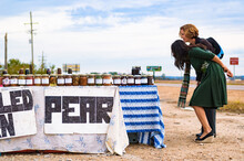 Two Women Smile While Selecting Preserves From A Roadside Stand Near Clarksdale, Mississippi