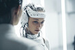 © Trinette Reed - Medical patient receiving futuristic brain treatment from doctor. Generative AI.