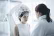 © Trinette Reed - Medical patient receiving futuristic brain treatment from doctor. Generative AI.