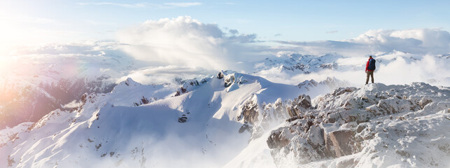 Wall Mural - Adventurous Man Standing on top of Mountain Cliff. Exteme Adventure Composite