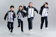 © Blue Jean Images - Studio shot of cheerful students