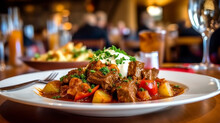 Traditional beef goulash with sauce and potatoes in luxury restaurant, healthy eating, Austrian cuisine