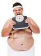 Overweight, scale bite and man upset with diet progress and weight loss goal in studio. White background, hungry and model with plus size stomach with body problem and health issue with towel